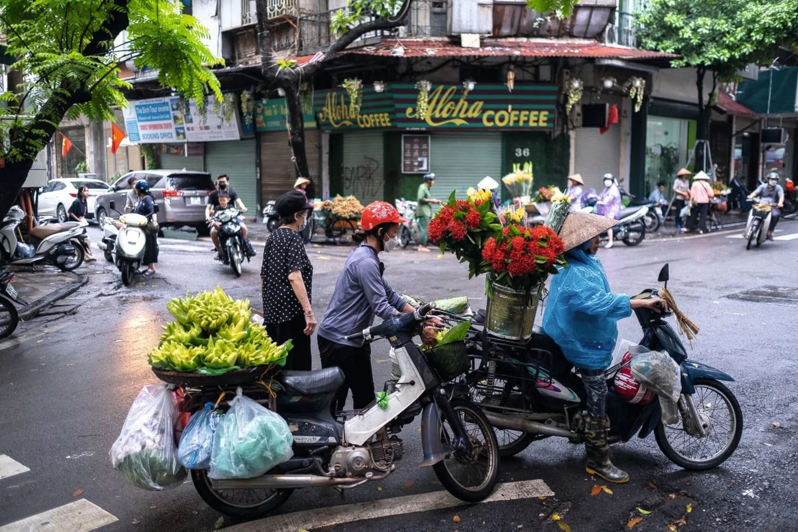 Street vendors with fruit, vegetables and flowers in central Hanoi