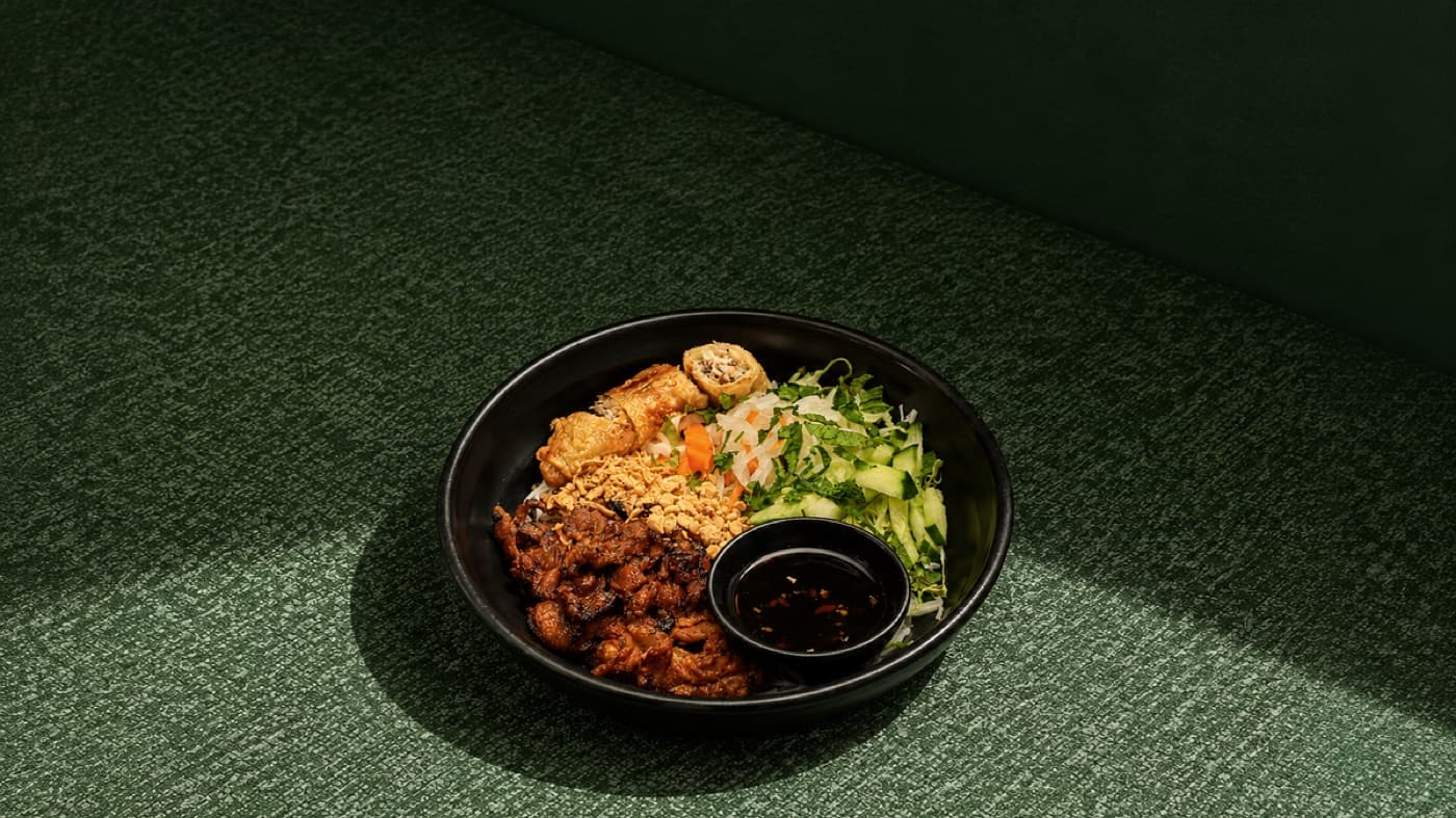 Bun Thit Nuong with chargrilled pork, spring rolls, herbs and vermicelli