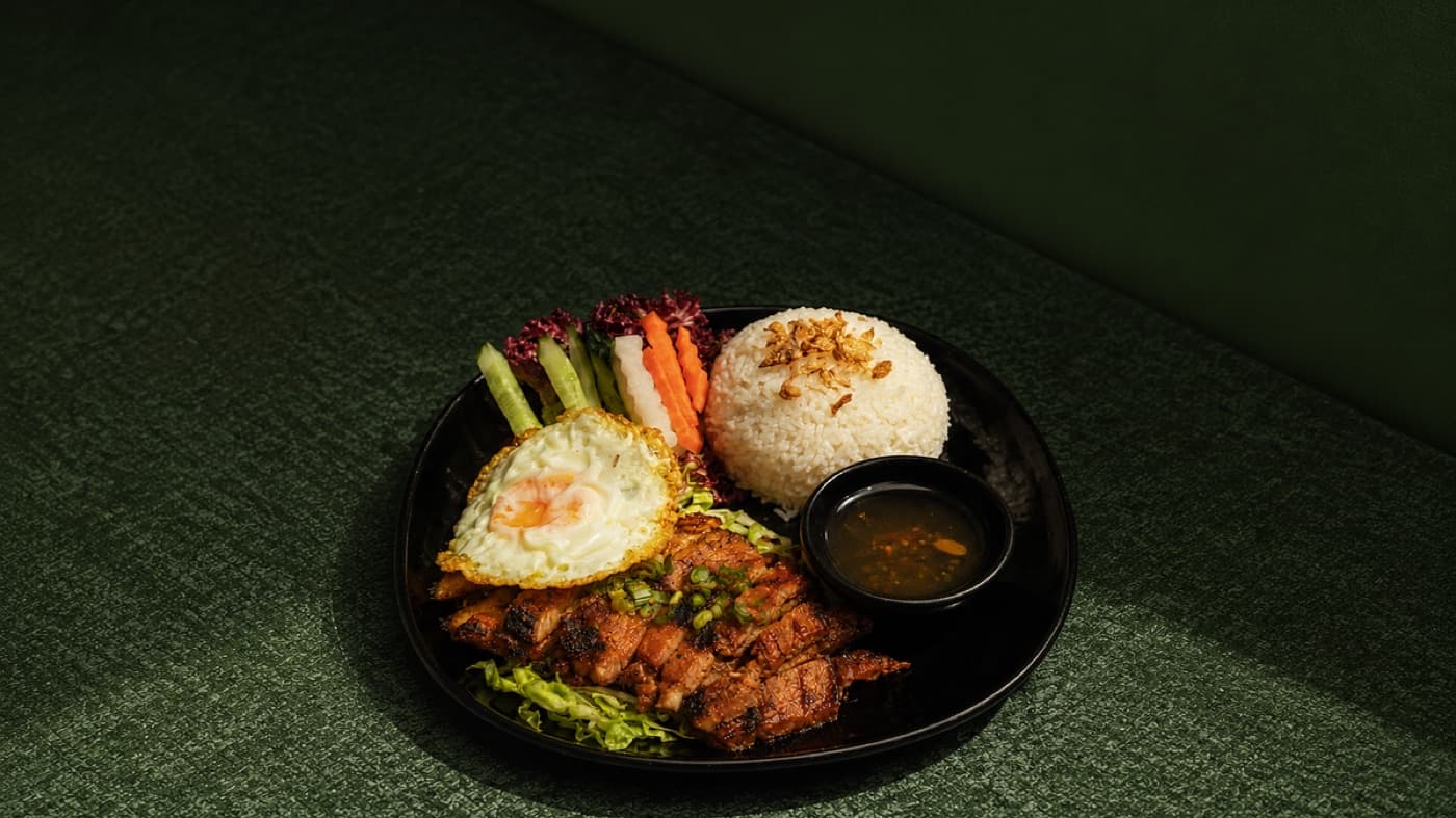 Com Tron rice bowl with grilled pork chop and pickles